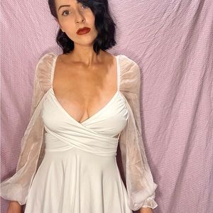 White criss cross front mini dress with sheer balloon sleeves